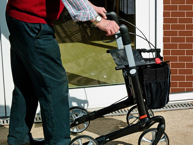 Resident walking outside using a mobility aid